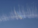 Rainbow In Clouds